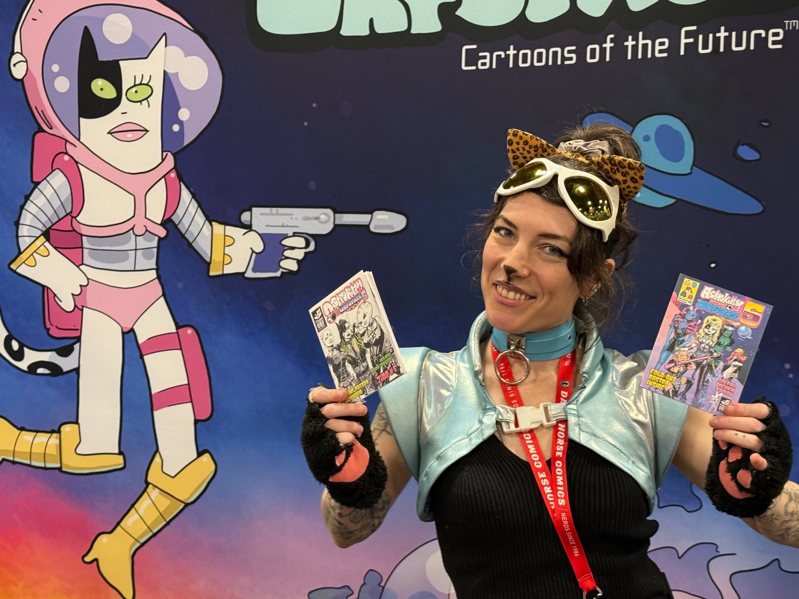 Kelty McGonagle holds up Astrokitty Zines